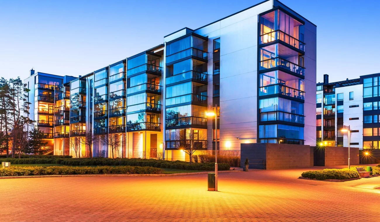 A contemporary residential building at dusk