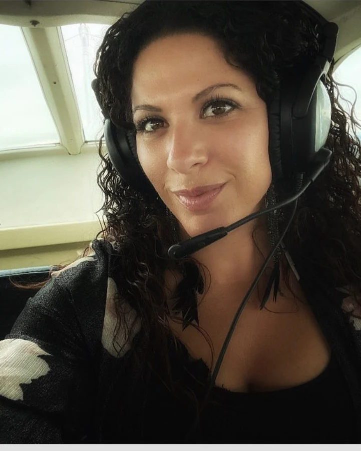 Kaya Maraya Silkiss-Hero, founder and owner of Kare Kontracting, flying over the San Juan Islands